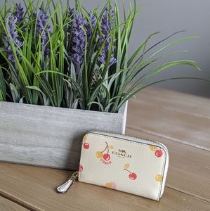 COACH zip around coin case